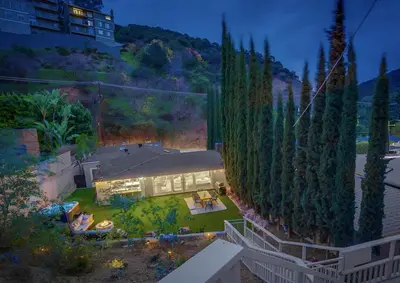 an aerial view of a house with a yard at Hollywood Hills Retreat - Private GYM & STEAM ROOM in Los Angeles
