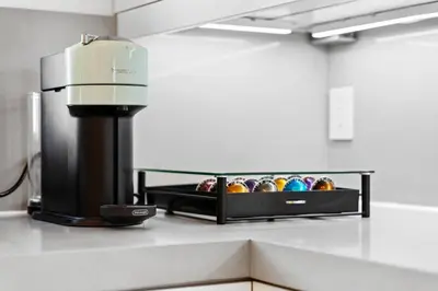 a mixer sitting on a counter next to a shelf of balls at The Diamond Dune Three floors Two Balconies BBQ in Los Angeles