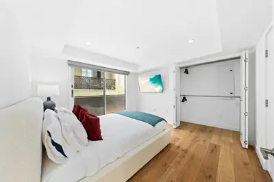 a white bedroom with a bed and a window at The Diamond Dune Three floors Two Balconies BBQ in Los Angeles