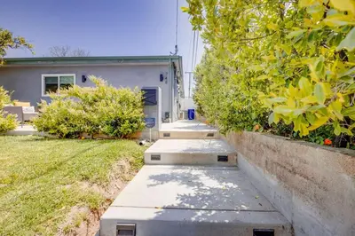 a concrete sidewalk in front of a house at NEW and Modern Cozy Flat in Southern California in Covina