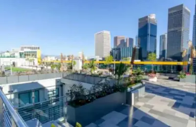a view of a city skyline from a building at Snug 3BR HighRise with Pool, Spa & Rooftop Views in Los Angeles
