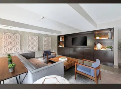 a living room with a couch and a tv at Cozy 2BR Apt in Downtown LA with Pool & Hot Tub in Los Angeles