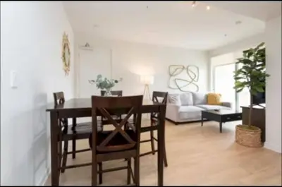 a living room with a table and chairs and a couch at Walk to Santa Monica Beach Pier Boardwalk Venice in Los Angeles