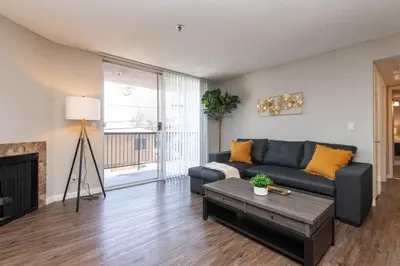 a living room with a couch and a fireplace at Modern Escape in Hollywood with Rooftop & City Views in Los Angeles