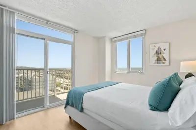 a bedroom with a bed and a large window at The Amethyst Retreat Ocean Marina Panoramic View in Los Angeles