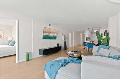 a living room with a couch and a table at The Amethyst Retreat Ocean Marina Panoramic View in Los Angeles