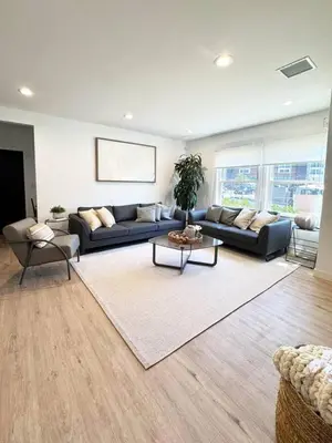 a living room with a couch and a table at Bright and Chic 3BR-3BA by Century City - FH-BV in Los Angeles