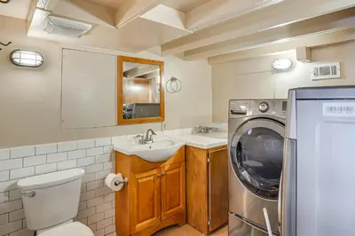a bathroom with a sink and a washing machine at Walk to Private Beach Rancho Palos Verdes Escape! in Rancho Palos Verdes
