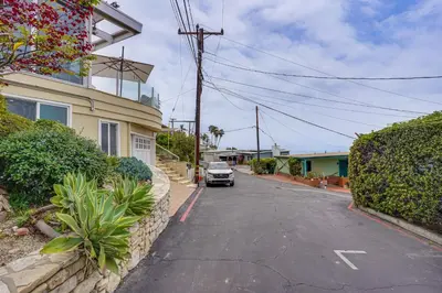 a car parked on a street next to a house at Walk to Private Beach Rancho Palos Verdes Escape! in Rancho Palos Verdes