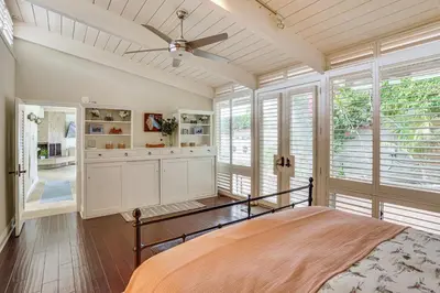 a bedroom with a bed and a ceiling fan at Walk to Private Beach Rancho Palos Verdes Escape! in Rancho Palos Verdes