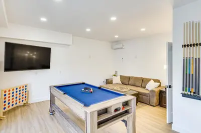 a living room with a ping pong table at 4 Mi to SoFi Stadium Pet-Friendly LA Area Home in Los Angeles