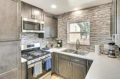 a kitchen with a sink and a stove at 4 Mi to SoFi Stadium Pet-Friendly LA Area Home in Los Angeles