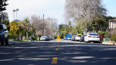 a street with cars parked on the side of the road at Cozy Private Guest House in Los Angeles