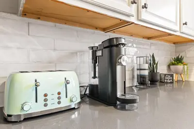 a toaster sitting on top of a kitchen counter at Bright Coastal Escape 4 Bedroom 2 Bath Near CSULB Long Beach Airport and Beach in Long Beach