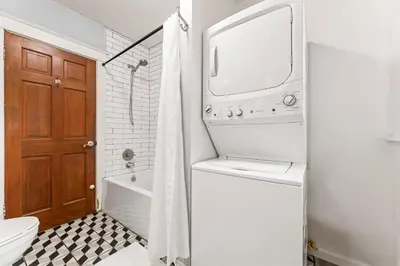 a bathroom with a toilet and a tub and a sink at Bright Coastal Escape 4 Bedroom 2 Bath Near CSULB Long Beach Airport and Beach in Long Beach