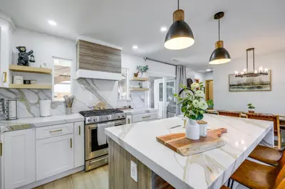 a kitchen with white cabinets and a white counter top at Walk to Big Bear Marina Modern Home with Hot Tub! in Big Bear Lake
