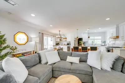 a living room with a couch and a kitchen at Walk to The Village ShopsandEats Big Bear Lake Home in Big Bear Lake