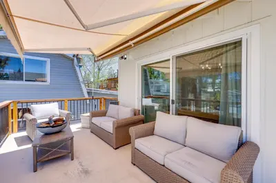 a patio with a couch and chairs on a porch at Walk to The Village ShopsandEats Big Bear Lake Home in Big Bear Lake