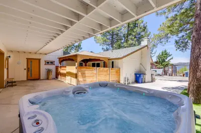 a large swimming pool in a yard with a house at Walk to The Village ShopsandEats Big Bear Lake Home in Big Bear Lake
