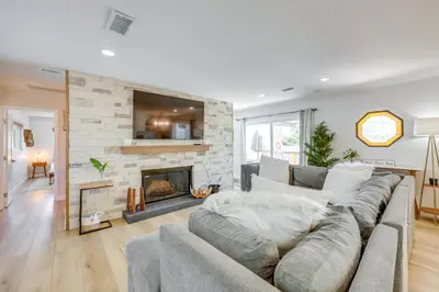 a living room with a couch and a fireplace at Walk to The Village ShopsandEats Big Bear Lake Home in Big Bear Lake