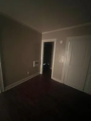an empty room with a door and a hallway at Living downtown in Long Beach