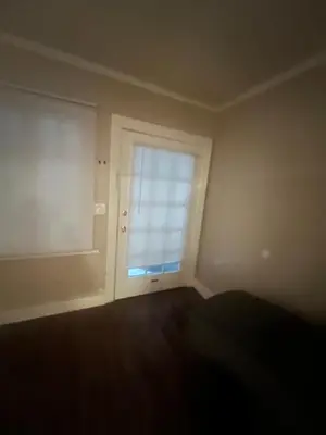 an empty room with a window and a door at Living downtown in Long Beach