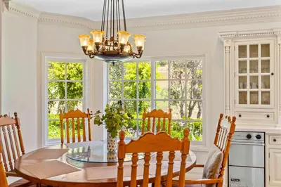 a dining room with a table and a chandelier at #Marbella Lane - Tranquil Country Escape Getaway in Placentia