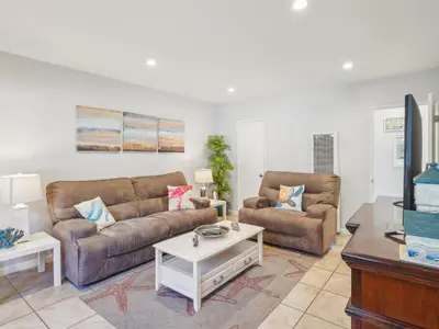a living room with two couches and a coffee table at Beautiful 2 Bed Beach Condo #104 in Carpinteria