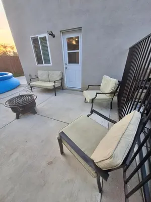 a patio with two chairs and a table at My amazing home in Azusa
