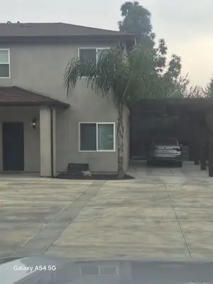 a house with a palm tree in a driveway at My amazing home in Azusa