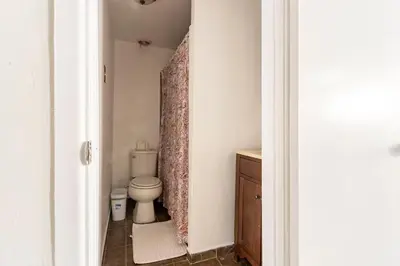 a bathroom with a toilet and a sink at Urban Casita in Los Angeles