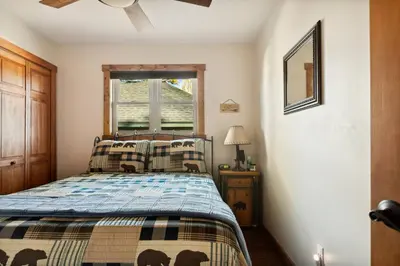 a bedroom with a bed and a window at Alpine Crest in Big Bear Lake in Big Bear Lake