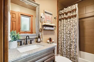 a bathroom with a sink and a shower at Alpine Crest in Big Bear Lake in Big Bear Lake