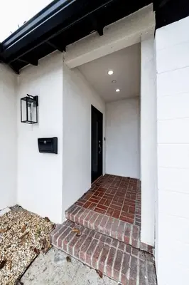 a brick walkway leading to a door of a house at NoHo Home Near Universal Studios in Burbank