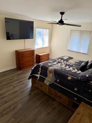 a bedroom with a bed and a ceiling fan at Recreation Ridge-Next To Boulder Bay-HUGE in Big Bear Lake
