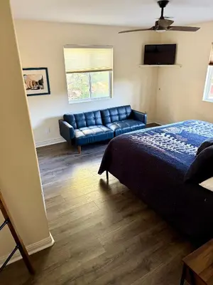 a living room with a couch and a bed at Recreation Ridge-Next To Boulder Bay-HUGE in Big Bear Lake
