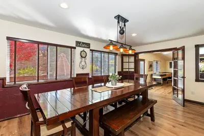 a dining room with a large wooden table and chairs at Recreation Ridge-Next To Boulder Bay-HUGE in Big Bear Lake