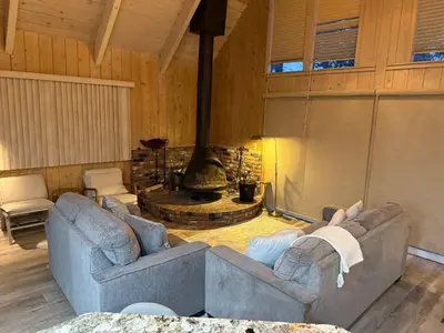 a living room with two couches and a fireplace at Casa Del Lago - Spacious 4 Story Gated Home in Lake Arrowhead