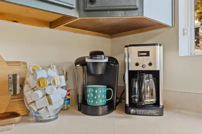 a kitchen counter with a coffee maker and a coffee pot at Chalet Vino - Snow Valley Mountain Resort in Green Valley Lake