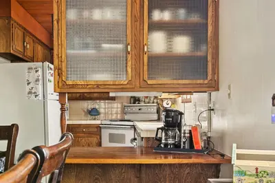 a kitchen with a coffee maker on a counter at Happy Bear Cabin - Hike Bike & More in Big Bear Lake
