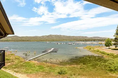 a view of a lake with boats in the water at The Adler's Nest - Lakefront with Pool Spa and Summer Dock in Big Bear Lake