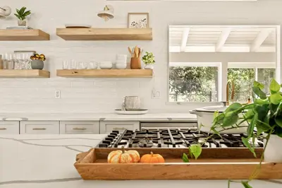 a kitchen with a stove with pumpkins on the counter at The Lilypad - 2 Master Bedrooms & Game Room in Lake Arrowhead