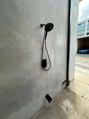 a wall with a blow dryer attached to a wall at MB Modern Sand Section Sea View in Manhattan Beach