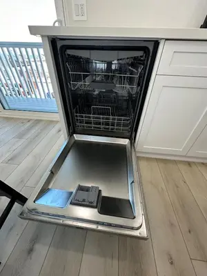 a dishwasher with its door open in a kitchen at Manhattan Beach Modern Panoramic Sea View in Manhattan Beach