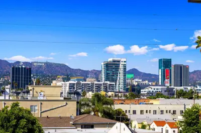 a view of a city with buildings and mountains at Serene Hollywood in Los Angeles