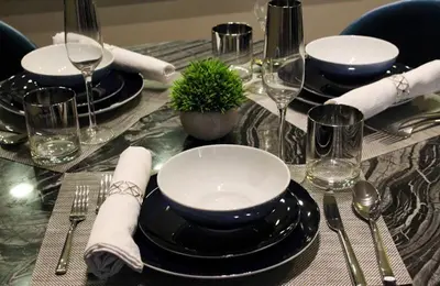a table with black plates and silverware on a table at Sexy One Bedroom Apartment - Pool View & Parking in Los Angeles