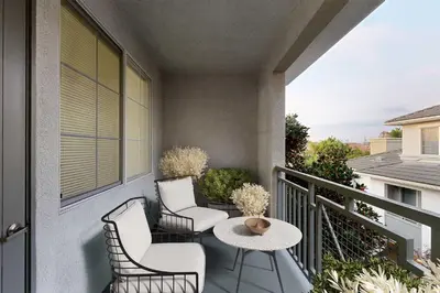 a balcony with two chairs and a table at Deluxe Living in Marina Del Rey - Pool, Hot Tub, Gym in Los Angeles