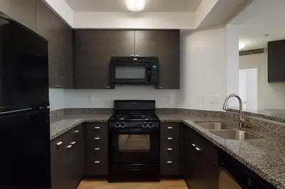 a kitchen with a stove and a sink and a microwave at Deluxe Living in Marina Del Rey - Pool, Hot Tub, Gym in Los Angeles