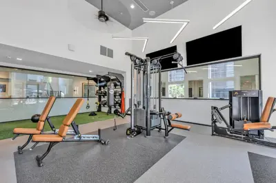a gym with cardio equipment and a flat screen tv at Deluxe Living in Marina Del Rey - Pool, Hot Tub, Gym in Los Angeles