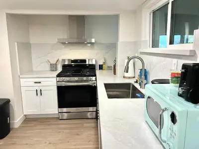 a kitchen with a stove and a sink at remodeled 2b 1b house Rosemead c in Rosemead